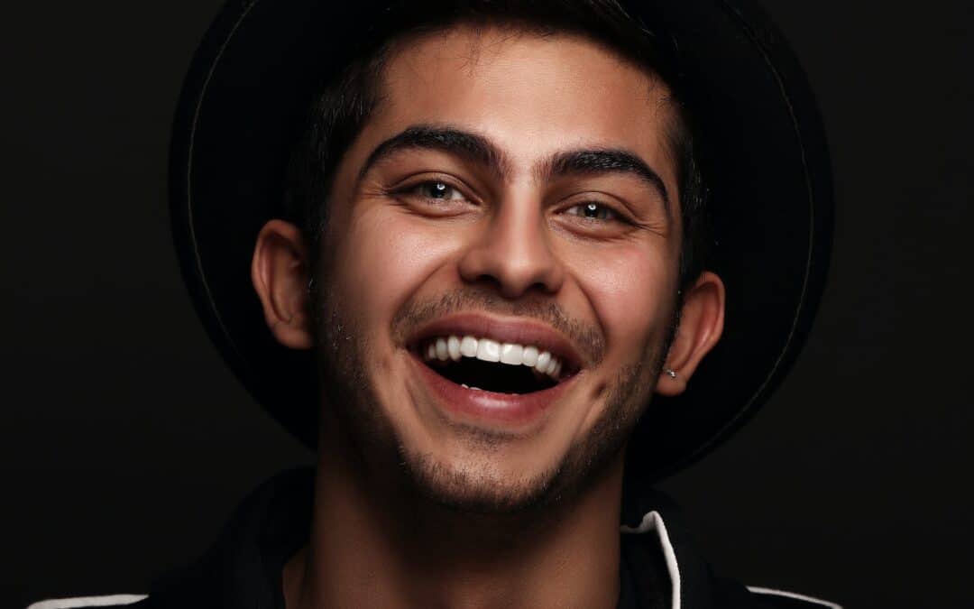 Woman with a big, bright grin smiles after teeth whitening in Oak Park, IL
