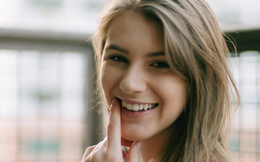 Girl turns and smiles after preventative dentistry treatments in Oak Park, IL