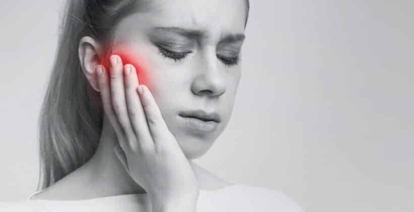 black and white image of woman with tmj pain